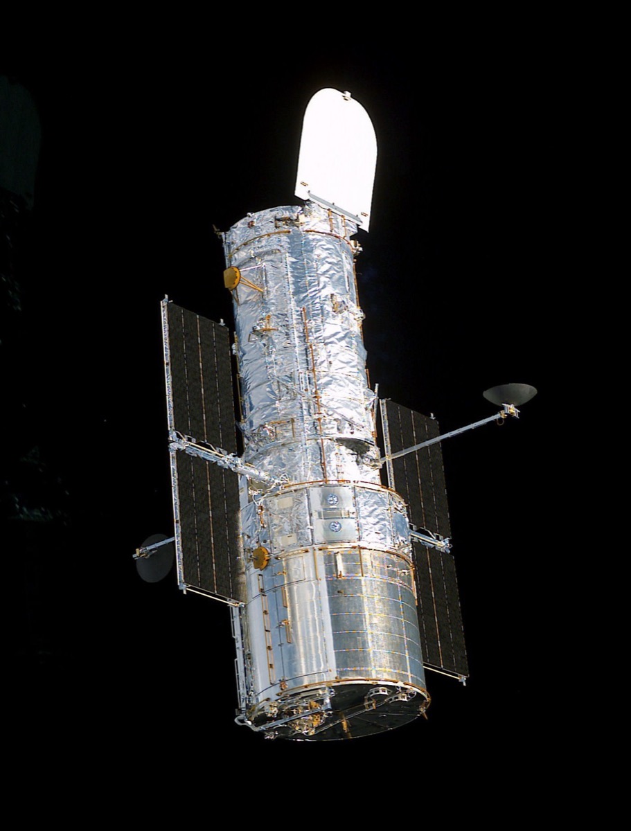 Side-by-side images of the Hubble Space Telescope and the James Webb Space Telescope.