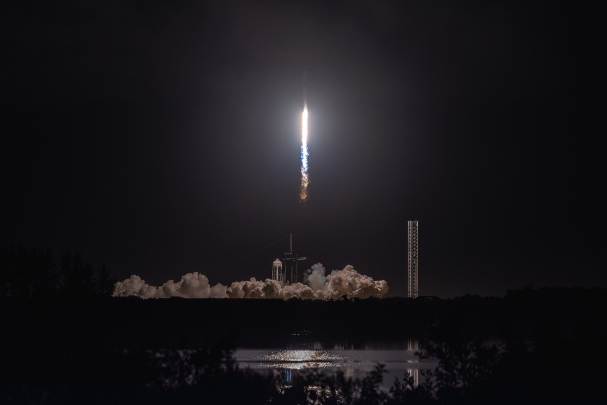 Jared Isaacman emerges from Crew Dragon's open hatch during the Polaris Dawn EVA.