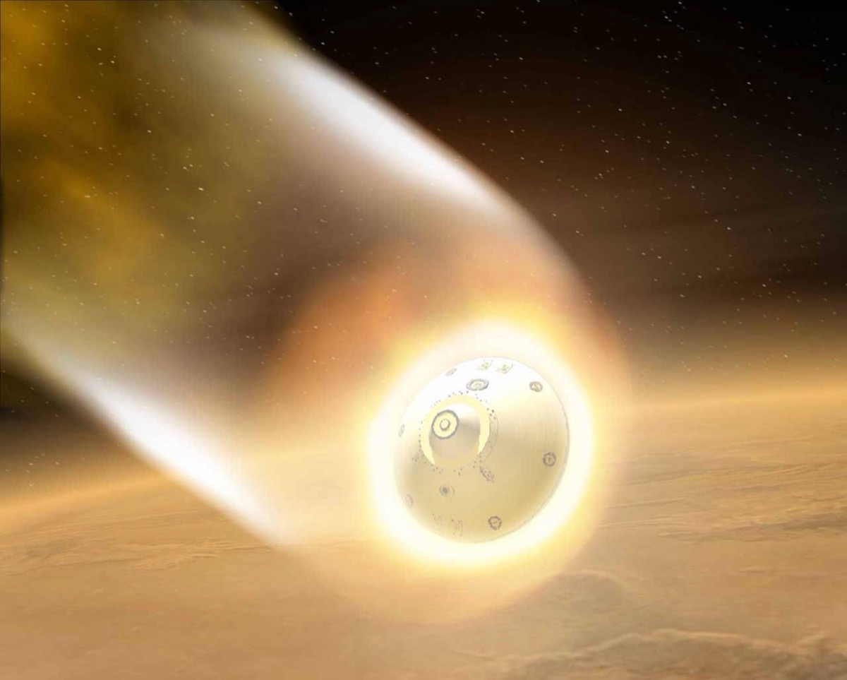 A SpaceX Dragon capsule glows orange during reentry, surrounded by superheated plasma.