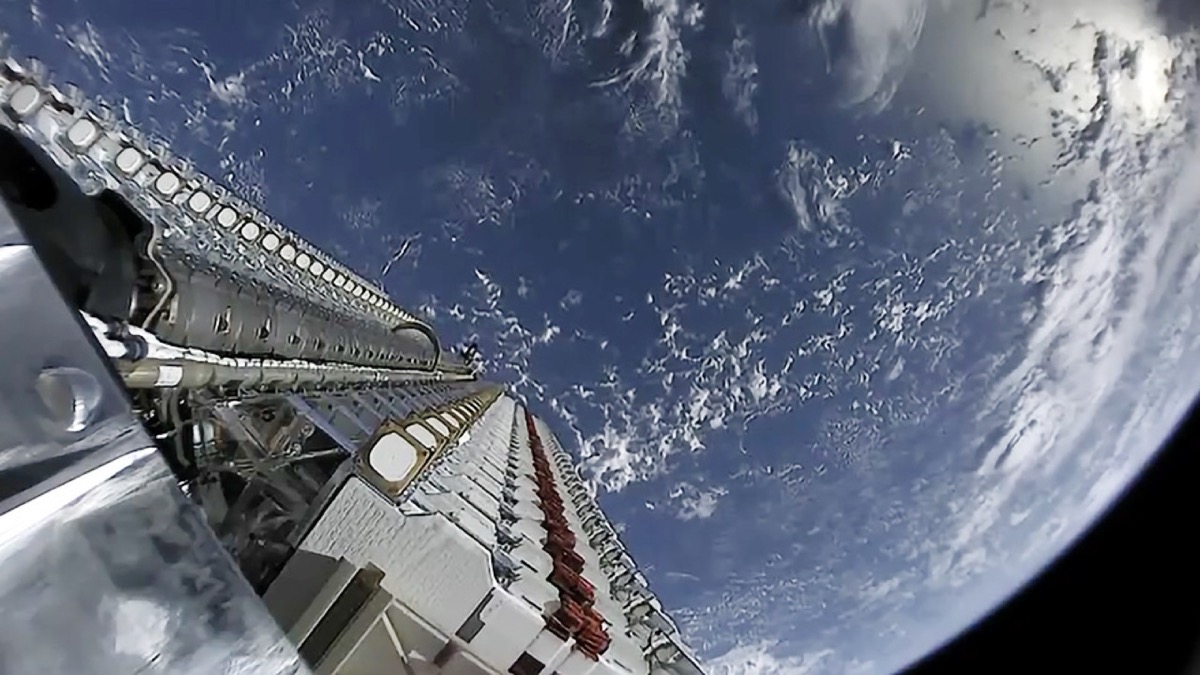 A train of Starlink satellites visible in the night sky shortly after deployment from a Falcon 9 launch.
