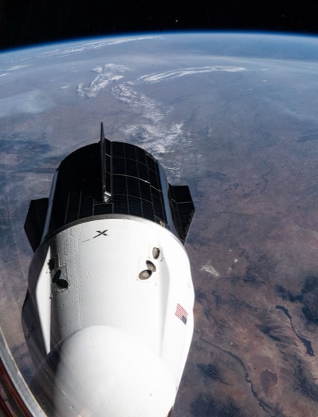A SpaceX Crew Dragon spacecraft approaches the International Space Station for docking.