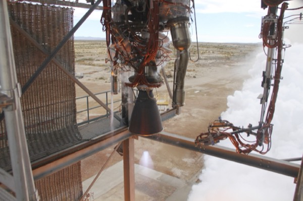 A rocket on the launch pad with liquid oxygen vapor venting in clouds during pre-launch fueling.
