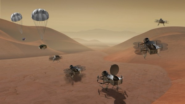 Artist rendering of NASA's Dragonfly rotorcraft hovering above the dunes of Saturn's moon Titan.