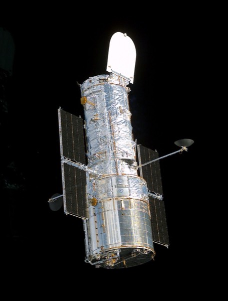 Side-by-side images of the Hubble Space Telescope and the James Webb Space Telescope.