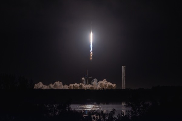 Jared Isaacman emerges from Crew Dragon's open hatch during the Polaris Dawn EVA.