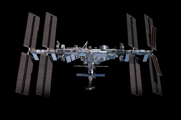 A screenshot of an ISS tracking app showing the station's orbital path and current position over Earth.