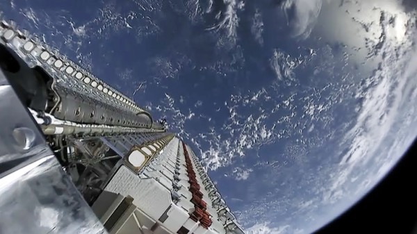 A train of Starlink satellites visible in the night sky shortly after deployment from a Falcon 9 launch.
