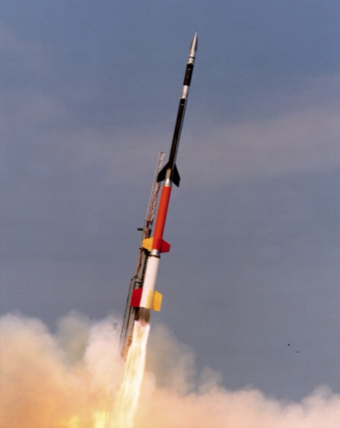 A Falcon 9 first and second stage separating during ascent, with the second stage engine igniting.